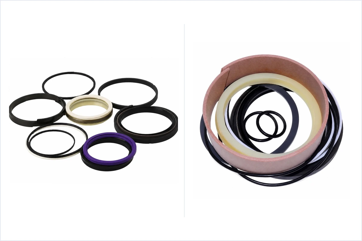 Side-by-side comparison of heavy excavator hydraulic cylinder seal kits laid out on a steel workbench showing SPGW 4-piece piston seals, IDI polyurethane rod U-cups, HBY buffer rings, DKB metal-cased wipers, and phenolic fabric wear rings